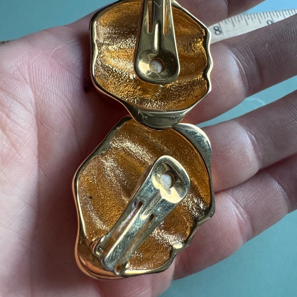 Large gold tone clip on vintage earrings